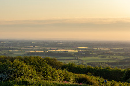 Sunset over the English countryside from the top of a hill.