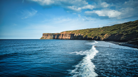 Beautiful seascape with cliffs and sea waves in Cornwall, UKの写真素材