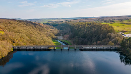 Aerial view of a bridge over a river in the countryside in springの写真素材