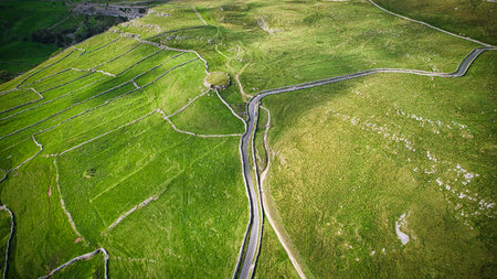 Aerial view of a winding road in the countryside in Scotland.の写真素材