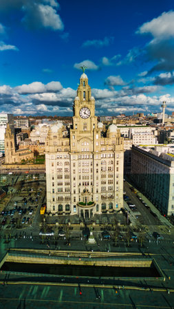 Aerial view of the historic Royal Liver Building in Liverpool, UK, with dramatic clouds in the sky.の写真素材