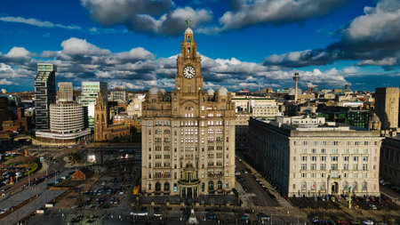Aerial view of a cityscape with historic buildings under a cloudy sky in Liverpool, UK.の写真素材