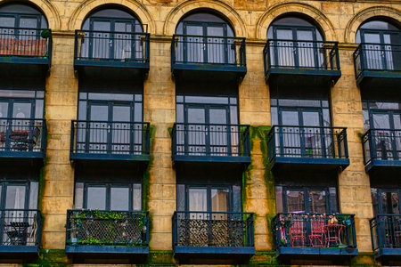 Facade of a vintage building with ornate windows and balconies in Leeds, UK.の写真素材