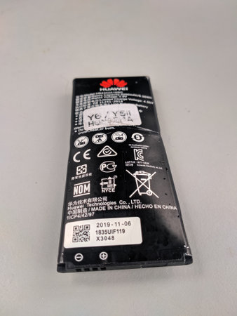 Malaysia, Kuala Terengganu 20 Disember 2020 : an inflatable Huawei brand smartphone battery and dangerous to use. Selective focus.のeditorial素材