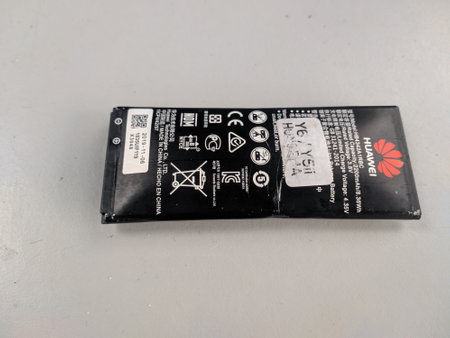 Malaysia, Kuala Terengganu 20 Disember 2020 : an inflatable Huawei brand smartphone battery and dangerous to use. Selective focus.のeditorial素材