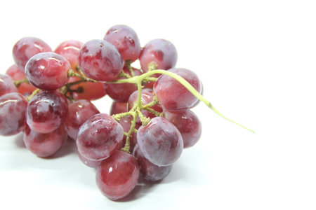 fresh purple grapes with a white background. Selective focus.の写真素材