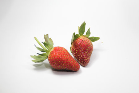 a bunch of creatively arranged strawberries with a white background. selective focus.の写真素材