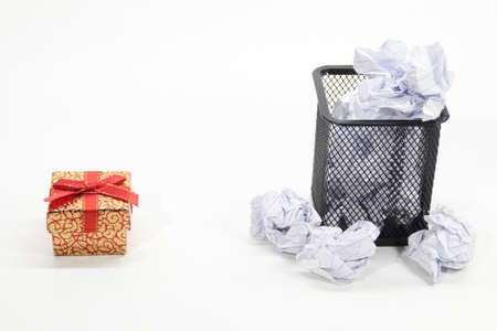 gifts and trash cans with a white background. Selective focus.の写真素材