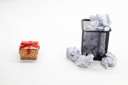 gifts and trash cans with a white background. Selective focus.の写真素材