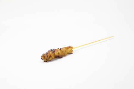 a mouthful of delicious and tasty chicken satay. Selective focus.の写真素材