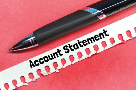 torn paper, pen with the word account statement