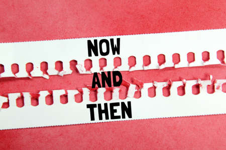 torn paper with the words now and thenの写真素材