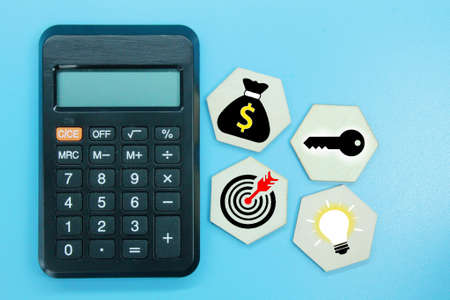 hexagon, calculator with targeted business icons and success conceptsの写真素材