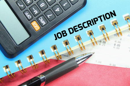 pen, notebook, calculator with the word JOB DESCRIPTIONの写真素材