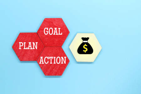 colored wooden hexagons with the words goal, plan and actionの写真素材