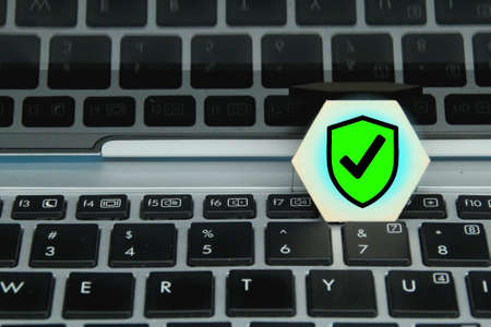 hexagon with security symbol and laptop background. safety and security conceptの写真素材