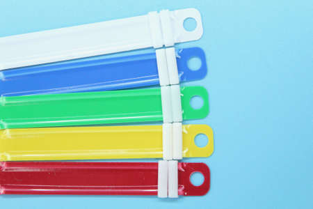PAPER FASTENER with a light blue background