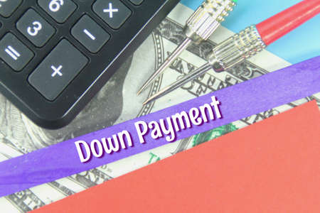 banknotes, calculators, purple ice cream sticks with the words Down Paymentの写真素材