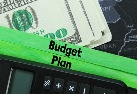 calculator, banknote, world map, with the word budget plan