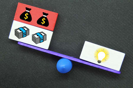 the balance between ideas and money and ideas is heavier than money. business concept