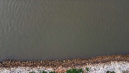 rocks on the shore from the top view. For background
