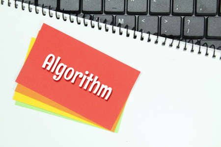 colored paper, white paper, laptop keyboard with word algorithmの写真素材