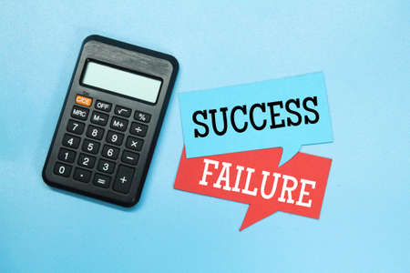 calculator, conversation box with the words SUCCESS and FAILUREの写真素材