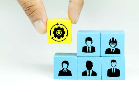 colored cubes with employee icons and placed management icons. business developmentの写真素材