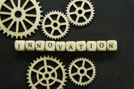 engine gears, wooden cubes with the word Innovationの写真素材