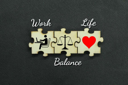 wooden jigsaw puzzle with Work, Balance and Life iconsの写真素材