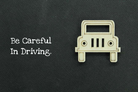 the front of a wooden car with the words be careful in driving