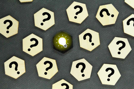 a hexagon with a question icon and a light bulb. concept idea