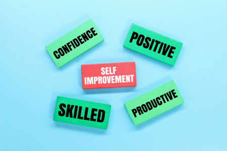 colored boards with words for self -improvement. self improvement conceptの写真素材