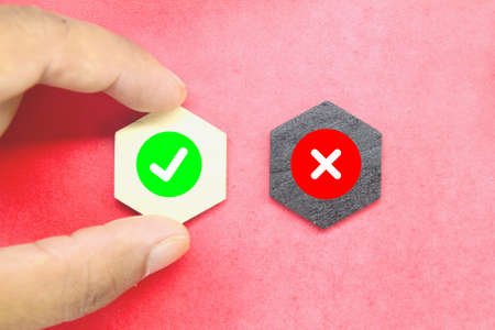 hexagon with a correct sign and one incorrect sign. the concept of check marksの写真素材