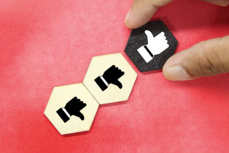 the up finger is selected and the down finger is left. business concept