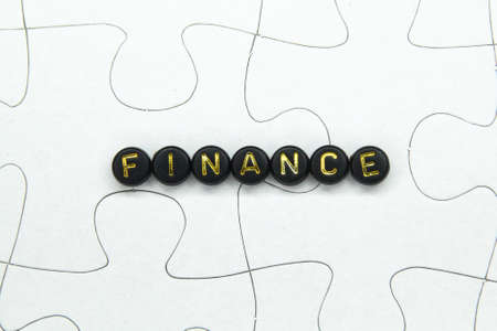 the word Finance is gold on the black circleの写真素材
