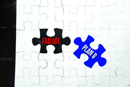 puzzle with the word Failure and replaced with plan B. the concept of successの写真素材