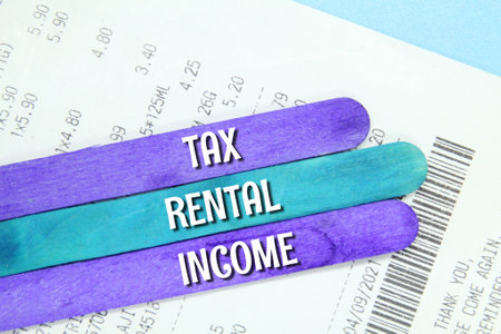 bill, a stick of colored ice cream with the words tax rental incomeの写真素材