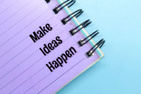 notebook with the words make ideas happenの写真素材