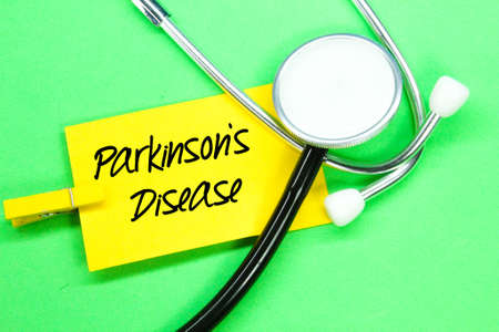 stethoscope and, colored paper with the words parkinson's diseaseの写真素材