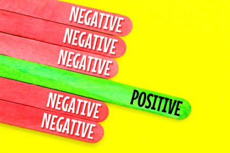 colored ice cream sticks with positive and negative words. the concept of attitudeの写真素材