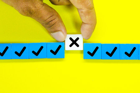 colored squares with the correct sign and one incorrect sign. the concept of check marksの写真素材