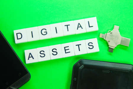 usb pendrives, smartphones and word digital assets. the concept of digital assetsの写真素材