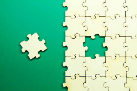 The copy image of the green background space is missing the puzzle. the concept of negotiationの写真素材