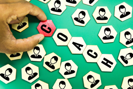 a hexagon with an employee icon and the word coach in the centerの写真素材