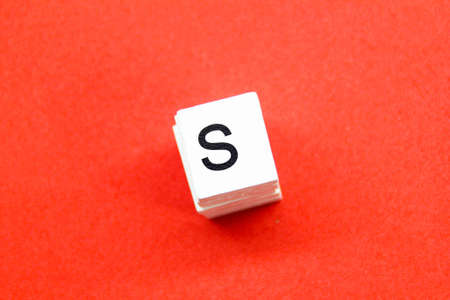 the letter s or the letter S on a white square with a red backgroundの写真素材
