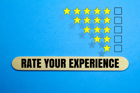 rate stars and wooden ice cream sticks with the words RATE YOUR EXPERIENCEの写真素材