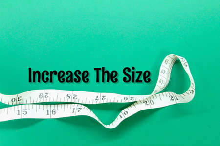 measuring tape with the words increase the sizeの写真素材