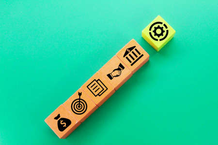 wooden cubes with a business concept. Components of building a successful business companyの写真素材