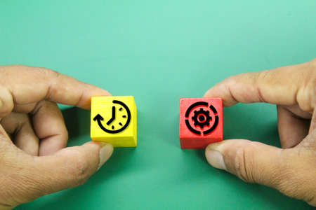 colored wooden cubes with time and management icons. time management conceptの写真素材